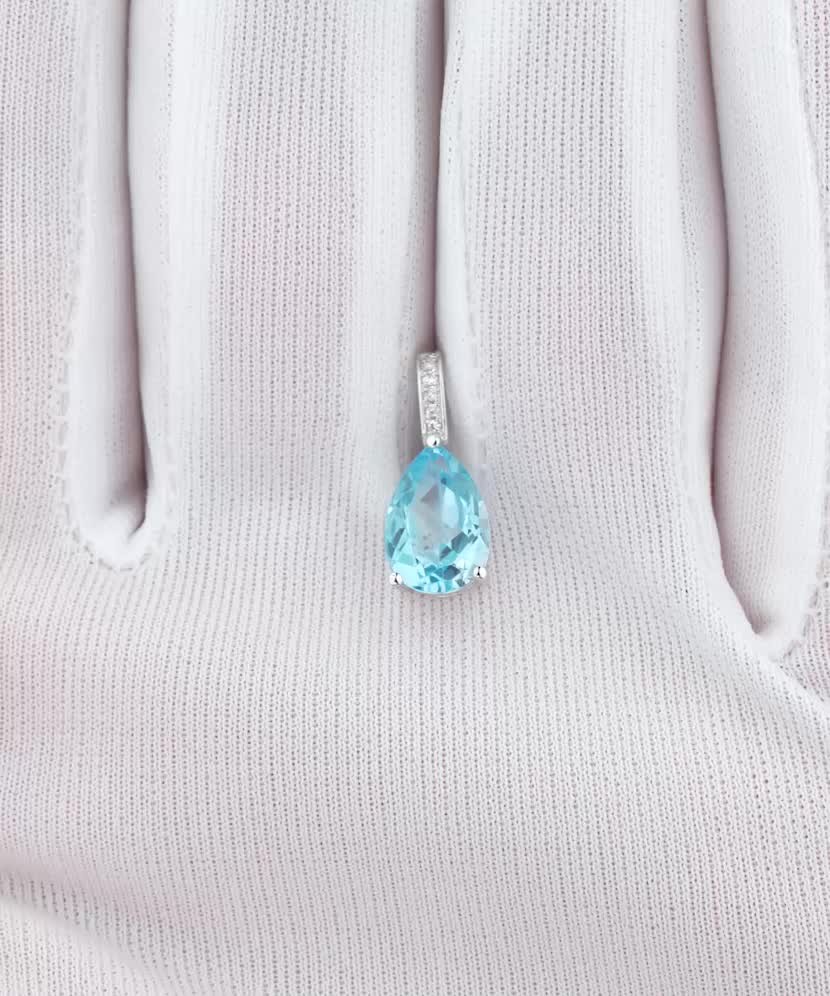 Balto aukso pakabukas su deimantais ir topazu