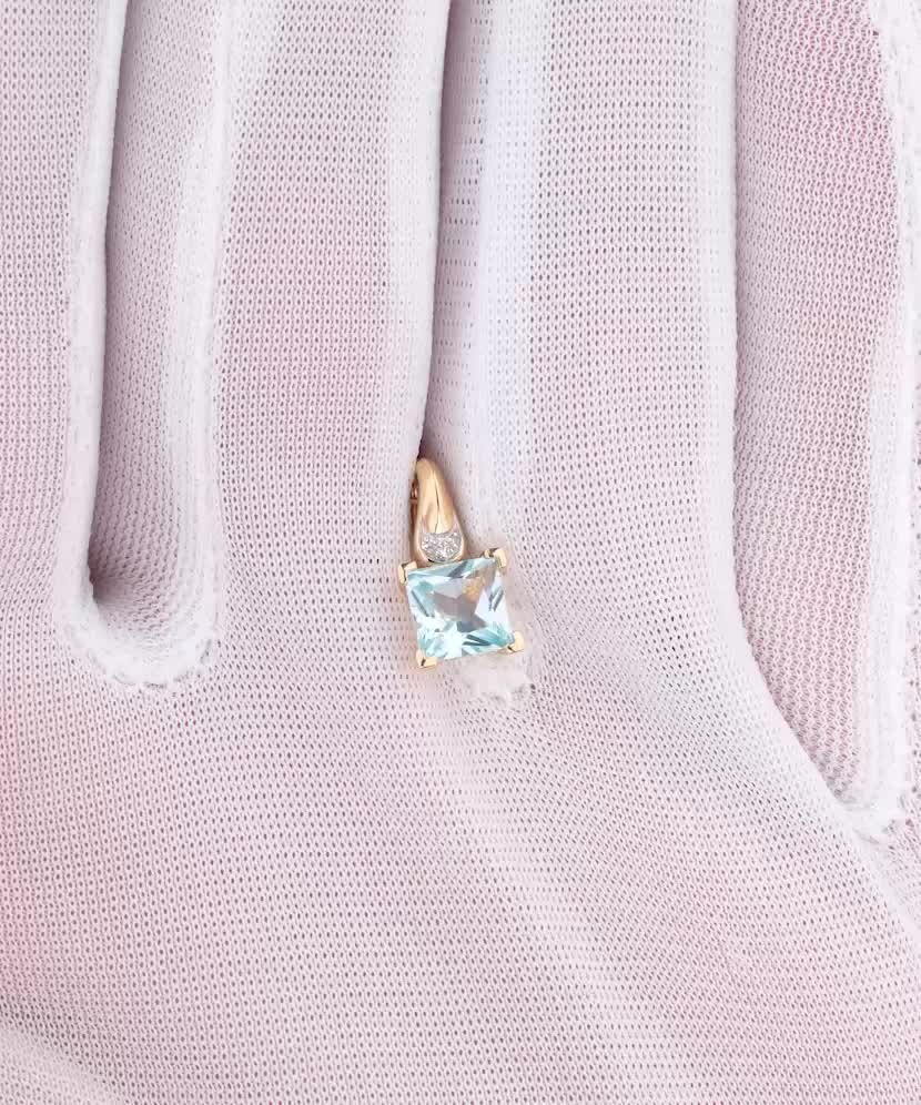 Geltono aukso pakabukas su deimantais ir topazu