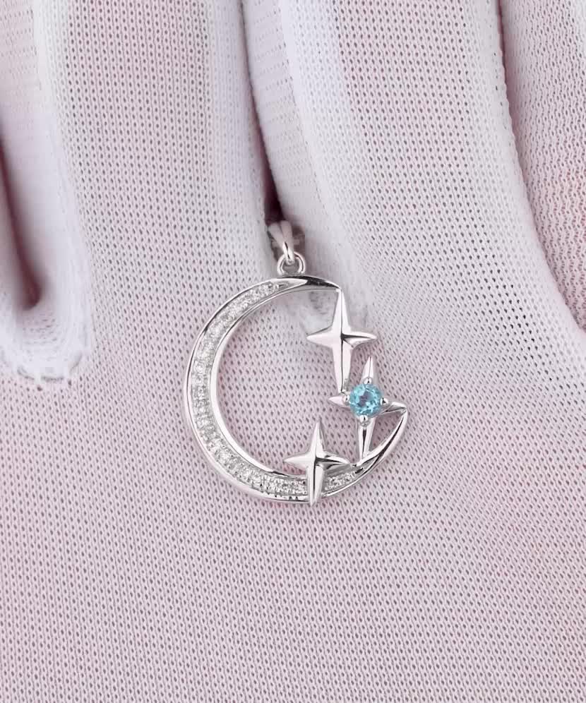 Balto aukso pakabukas su deimantais ir topazu